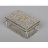 A Victorian cut glass and silver topped dressing table box by Charles Rawlings & William Summers.