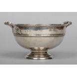 An Edwardian silver twin handled pedestal bowl by Thomas Edward Atkins. Assayed Birmingham 1908, 323
