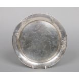 A planished sterling silver dish embossed to the rim with bamboo shoots. Engraved to the centre with