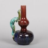 A small Burmantofts Faience double gourd dragon vase. Glazed in tones of indigo and brown and