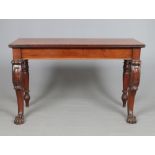 An early 19th century Irish mahogany console table. With carved double scrolling supports