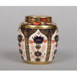 A Royal Crown Derby Imari tea jar and cover. Printed mark, pattern 1128, 10.5cm.