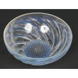A Rene Lalique opaline Art Deco coupe bowl decorated in the Poissons pattern. Reverse moulded with a