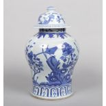 A 20th century decorative Chinese blue and white baluster jar and cover. Painted in underglaze