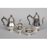 A silver four part tea and coffee service by Cooper Brothers  Sons Ltd. Comprising a teapot,
