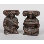 A pair of 17th century figural oak carvings incorporating ionic capitals, 17.5cm.
