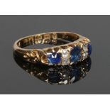 A Victorian 18 carat gold sapphire and diamond seven stone ring. Assayed Birmingham 1891, size M.