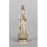 A 19th century eastern carved ivory small statue. Formed as a female deity and raised on a lotus