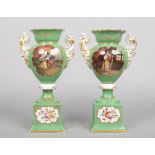 A large pair of early 20th century Paris porcelain twin handled mantel urns. Green ground, gilded