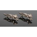 A pair of George V cast silver models of running foxes by William Hutton & Sons Ltd. Assayed