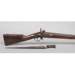 A 19th century French percussion cap musket. With walnut fullstock and socket bayonet. Lock plate