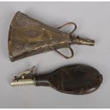 A 19th century leather powder flask with spring loaded mechanism along with an eastern copper and