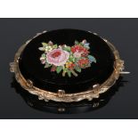 A 19th century Italian micro mosaic brooch. Mounted in yellow metal and depicting a bouquet of