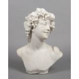 A 19th century Continental carved marble bust. Formed as a Bacchanalian maiden with a wreath of
