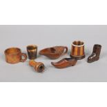 A tray of assorted treen items. Including a Norwegian jug, carved boot, small mug and a horn beaker.