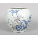 A large Chinese ovoid jar. Painted in underglaze blue and red with birds on the branches of a