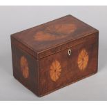 A Regency mahogany tea caddy with strung inlay and fan patera, 16.75cm wide.