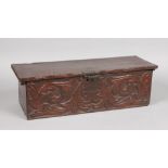 A period oak box with foliate carving to the front and having iron lock plate, 74.5cm.
