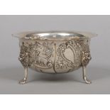 An Edwardian silver presentation bowl by Williams Ltd. With scalloped rim, embossed with animals and