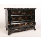 A 19th century Japanned bombé shaped table cabinet. With scalloped hinged top, canted corners, a