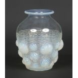 An Art Deco Verlys opaline glass vase. Moulded with roundels over a waved and ribbed ground.