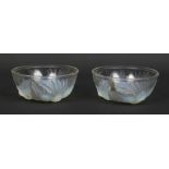 A pair of Art Deco Jobling opaline glass bowls. Each moulded with three birds around a central