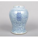A 19th century Chinese blue and white baluster vase. Painted in underglaze blue with lotus scrolls
