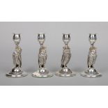 A set of four zoomorphic silver plated table candlesticks by Roberts & Belk of Sheffield. Each