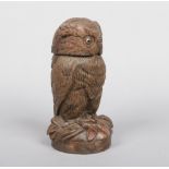 A Black Forest carved walnut tobacco jar and cover modelled in the form of an owl, 28cm.