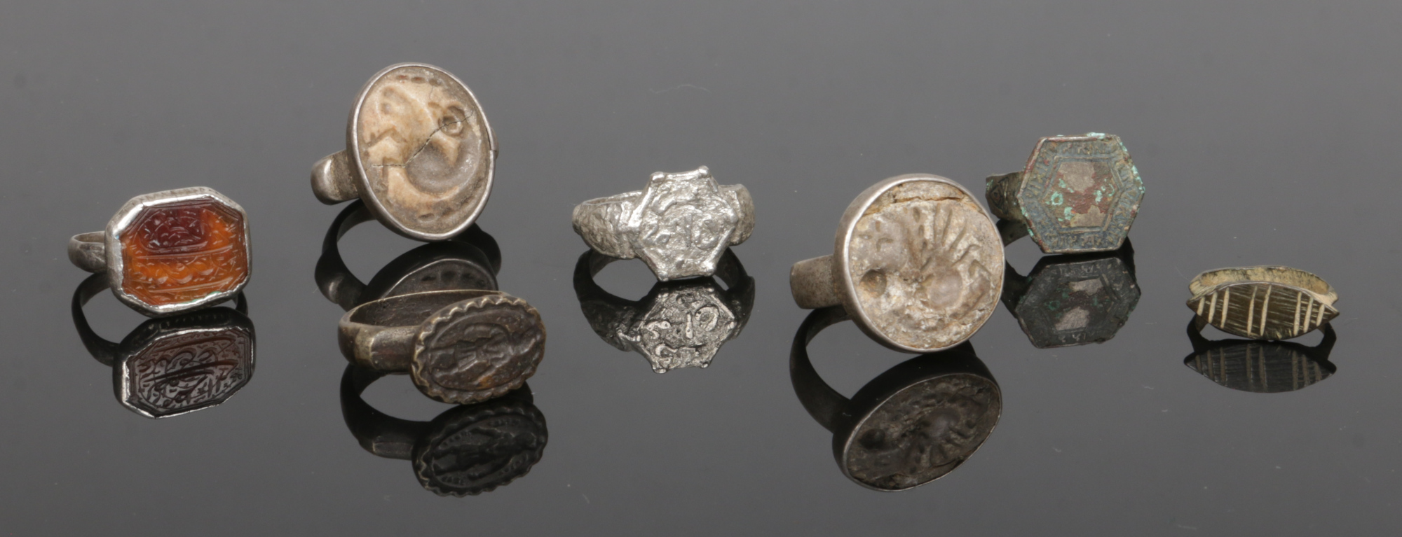 Seven antique seal rings. Including intaglios and one carved with Arabic script to a canted