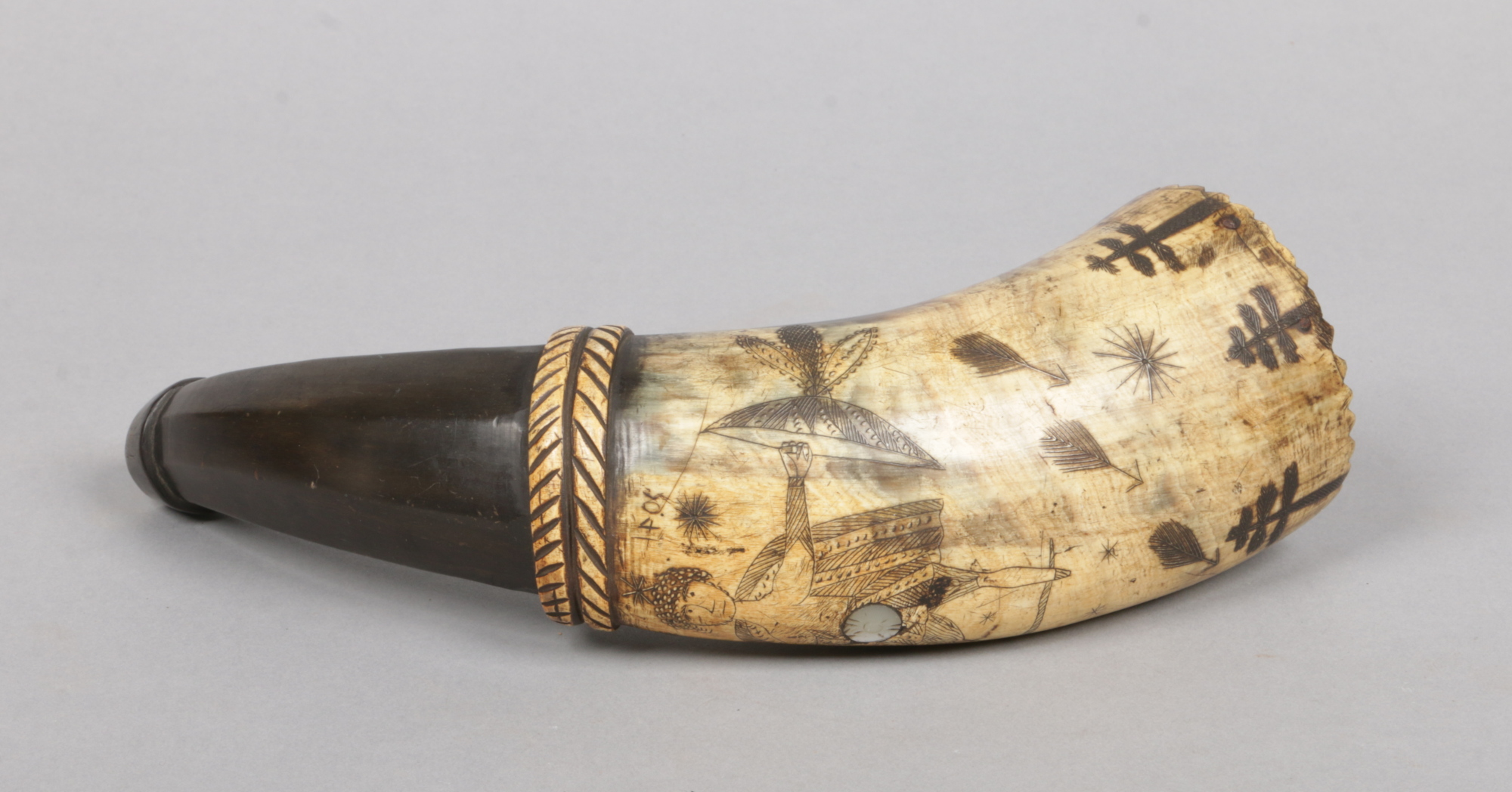 A 18th century Continental horn hunting flask with incised figural decoration, 25cm.