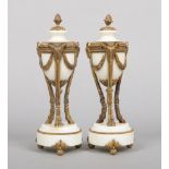A pair of French Neo-Classical alabaster and gilt metal mantel urns. With acorn finials and