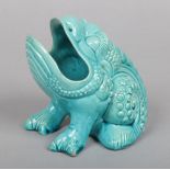 A Burmantofts Faience grotesque spoon warmer. Modelled in the form of a seated bullfrog and glazed
