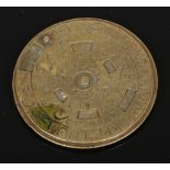 An 18th century German brass perpetual pocket disc calendar. Inscribed Calendarium Perpetuum.