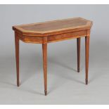 A Regency burr yew wood fold over card table crossbanded in satinwood. With canted corners and