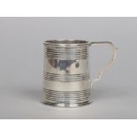 A William IV silver tankard by John Walton. With banded decoration and flat scrolling handle.