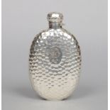 A Victorian hammered silver hip flask. Engraved with a P. W. monogram. Assayed Birmingham 1892,