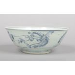 A Chinese Swatow ware bowl probably 17th century. Painted in underglaze blue with a dragon and