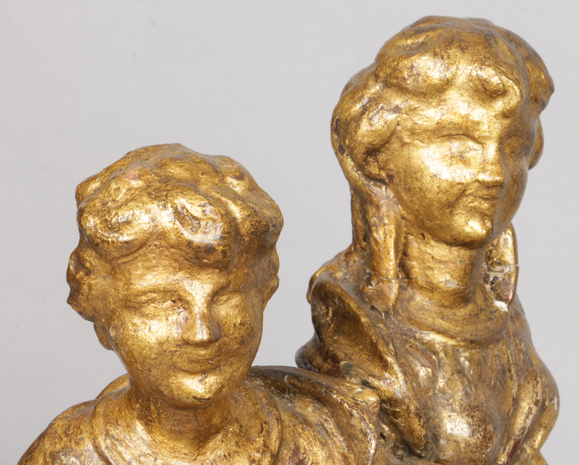 An antique Continental carved giltwood sculpture. Formed as two figures and a winged putti riding in - Image 4 of 4