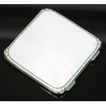 An Art Deco silver and guilloche enamel powder compact by Adie Bros. With white ground top and