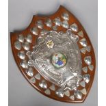 A large George V silver mounted oak trophy shield for the Huddersfield and District Brass Band