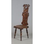 An Art Nouveau carved oak spinning chair raised on turned supports.
