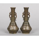 A pair of Japanese Meiji period bronze overlay vases. With twin handles formed as mythical creatures