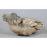 An antique carved gritstone gargoyle formed as a winged ram, approx 74cm long, 38cm wide, 40cm
