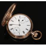 A 9 carat gold cased full hunter calendar pocket watch in engraved case. With enamel dial having two
