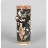 A Japanese Meiji period Satsuma sleeve vase. Black ground, painted with figures and leaves and