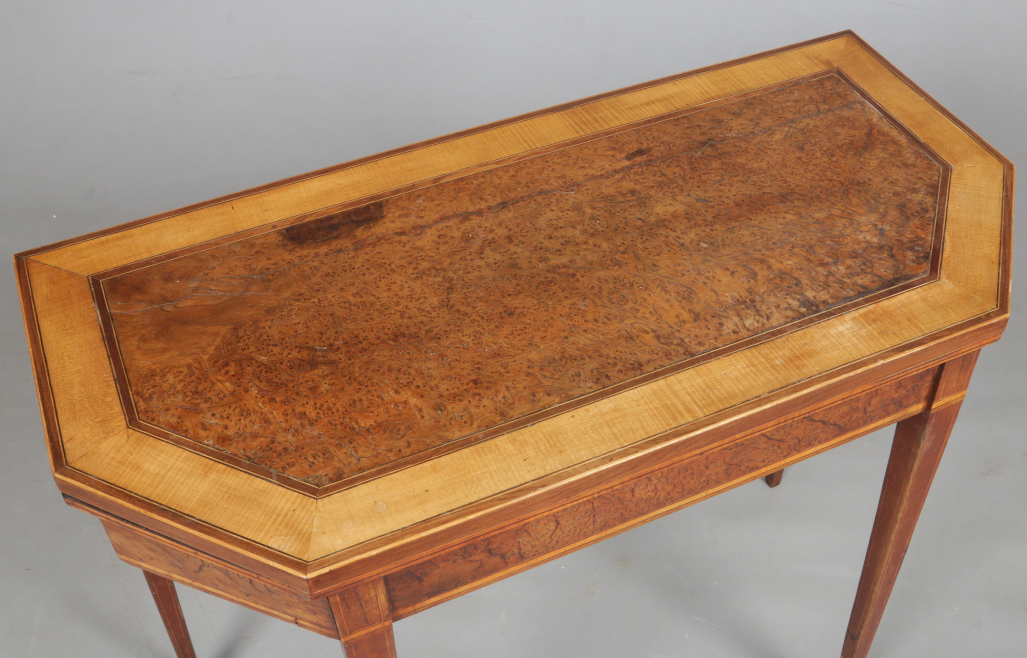 A Regency burr yew wood fold over card table crossbanded in satinwood. With canted corners and - Image 2 of 2