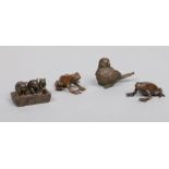 A pair of Japanese miniature bronze models of frogs, a group of three pigs feeding from a trough and