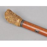 A Victorian malacca opera stick with antler grip.