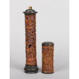 Two Chinese carved and stained boxwood scroll jars with horn capitals. Largest 27cm.Condition report